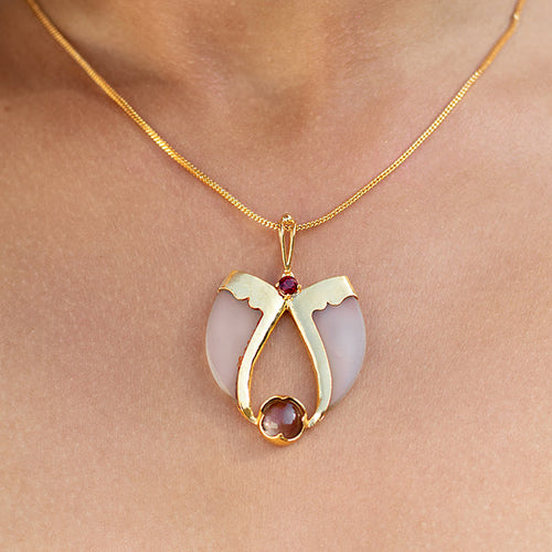 AVANI Gold Faux Tiger Claw Red Lens Pendant